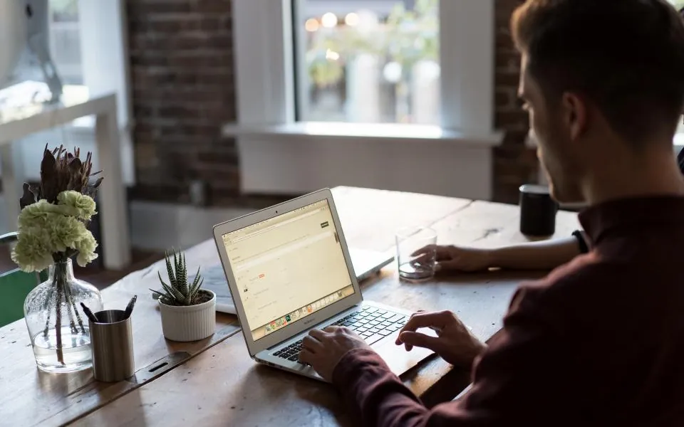 Student joining a live online class on a laptop at home